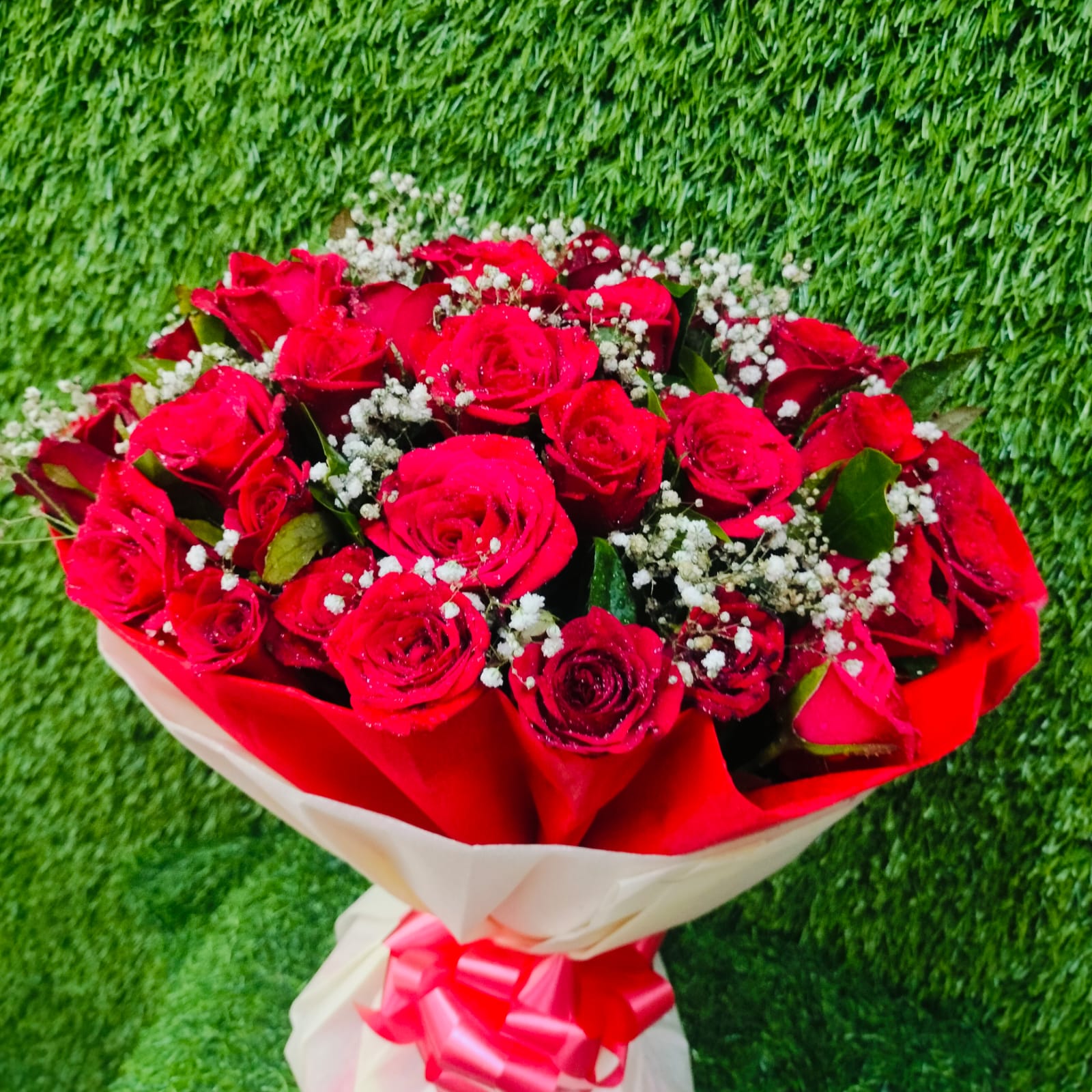 Beautiful bouquet of red roses with white fillers – FlowerDekho