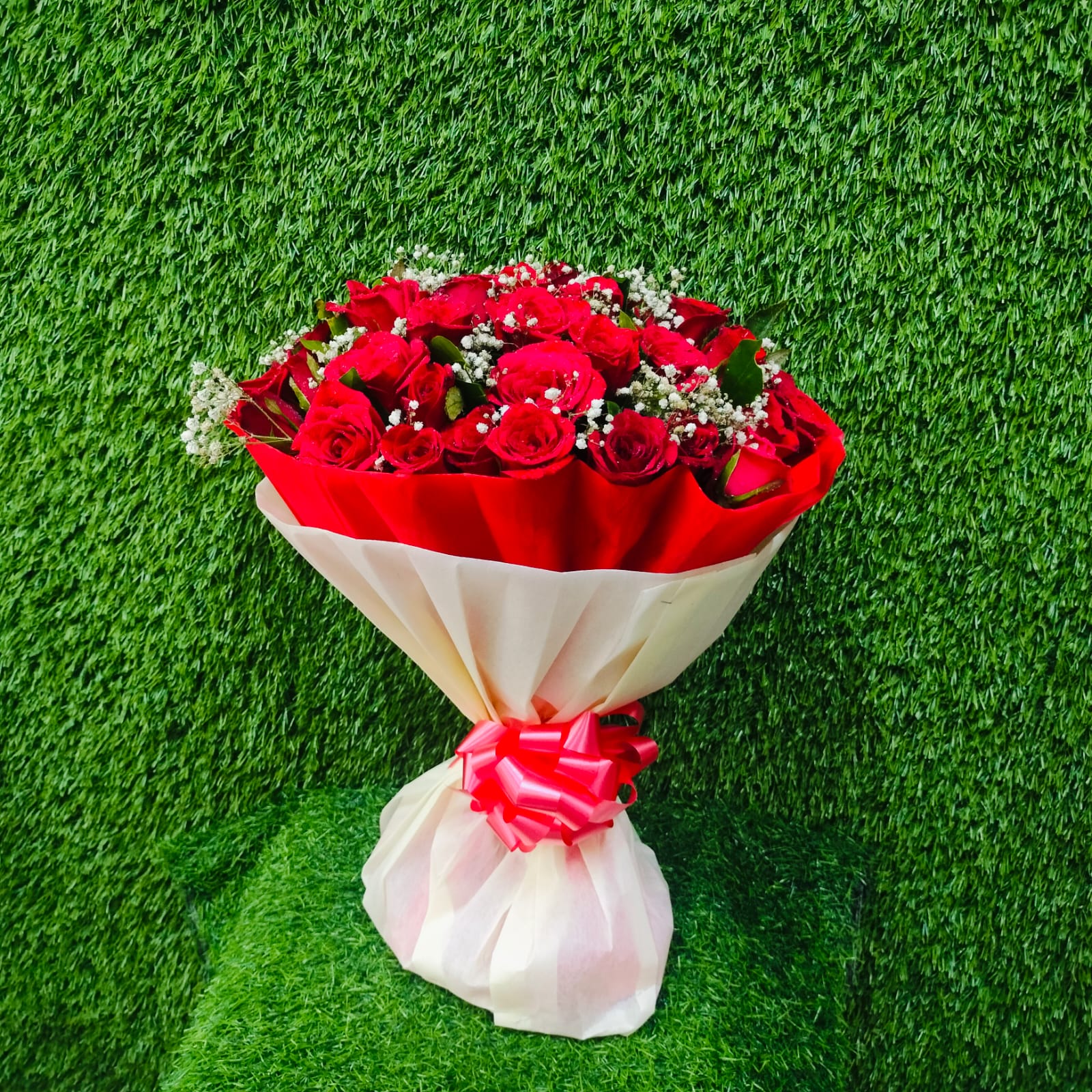 Beautiful bouquet of red roses with white fillers – FlowerDekho