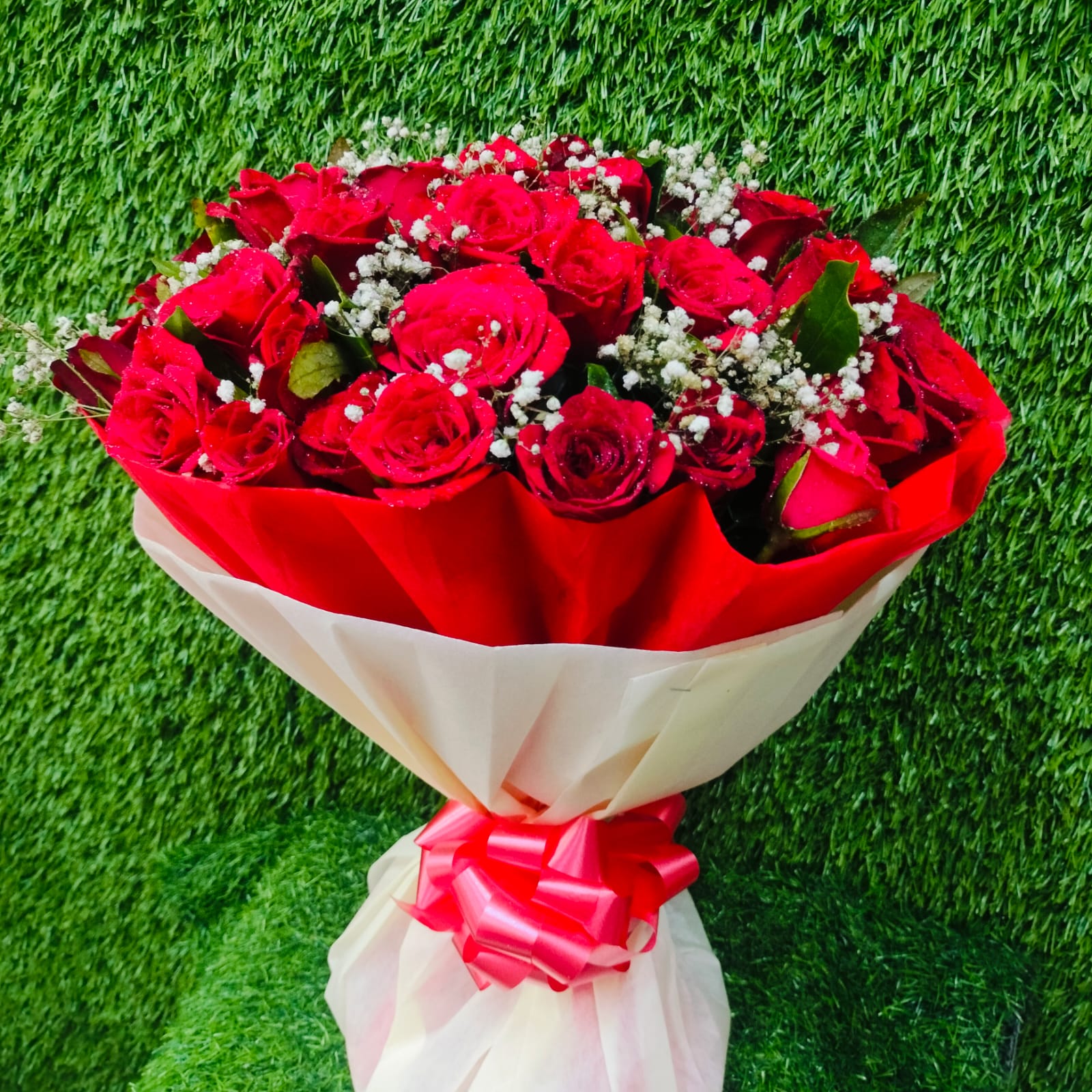 Beautiful bouquet of red roses with white fillers – FlowerDekho
