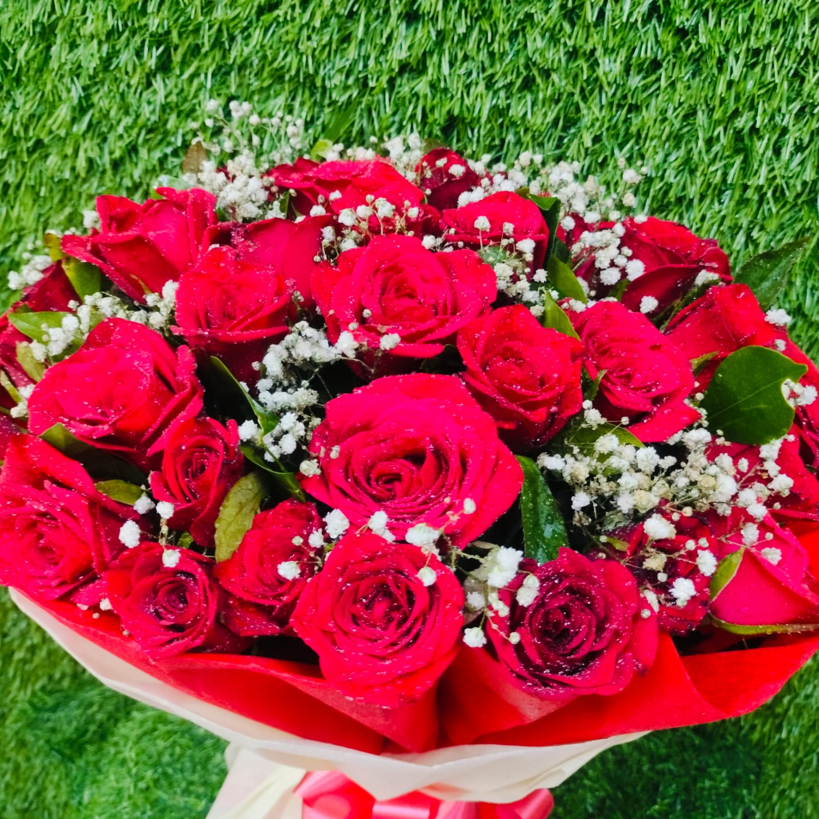 Beautiful bouquet of red roses with white fillers – FlowerDekho
