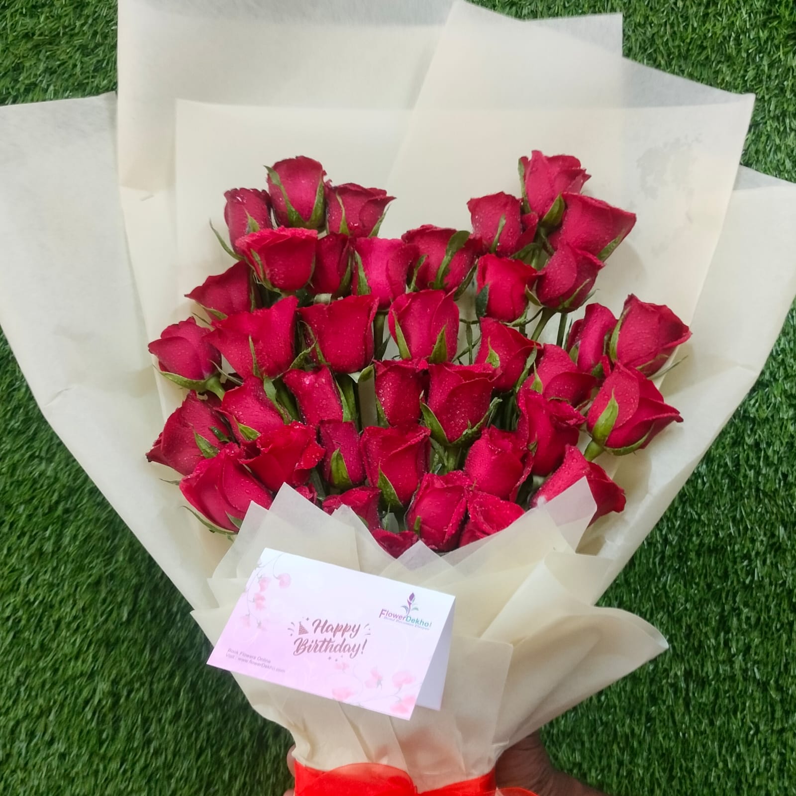 50 red rose bouquet wrapped in white paper – FlowerDekho