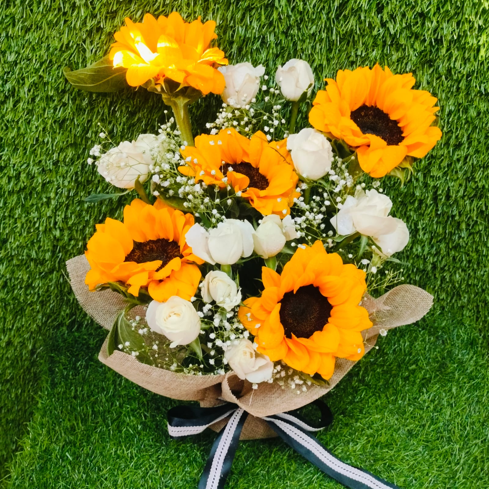 Yellow and pink flower arrangement in black box – FlowerDekho