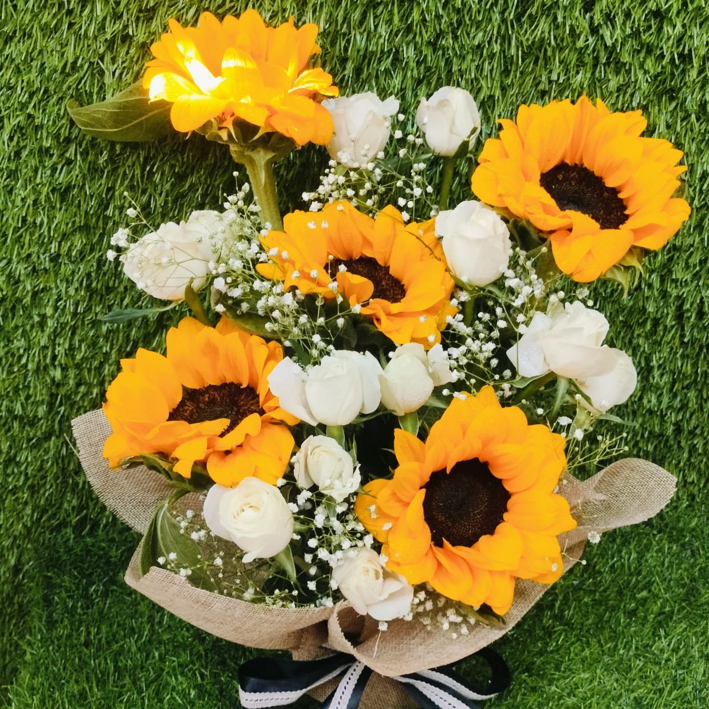 Yellow and pink flower arrangement in black box – FlowerDekho