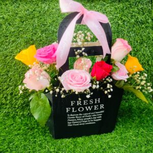 Black gift box with pink roses and greenery – FlowerDekho
